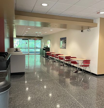 view of cafe chairs and tables along rear wall
