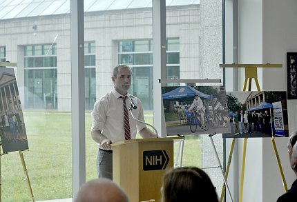 Cullinane speaks at a podium