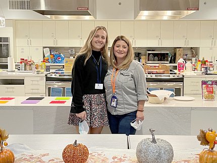 Mays (l) and Stonebanks smile in inn kitchen