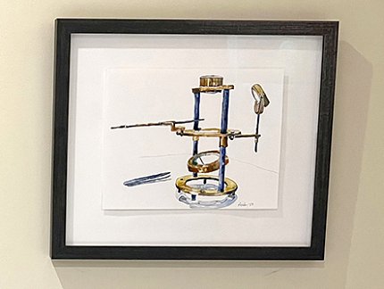 Vintage microscope vaguely resembling a scaffold with several round clear glass plates attached to the sides