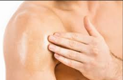 Man applies gel to shoulder