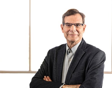 Dr. Kenneth Pargament, silhouetted against a window.