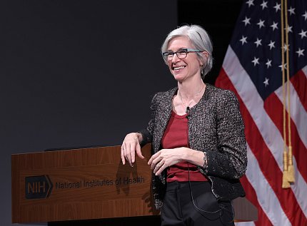 Doudna speaks at a podium