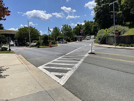 A crosswalk that guides pedestrians across a complicated intersection.