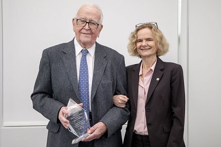 Dewey poses with his award with Volkow at his side.