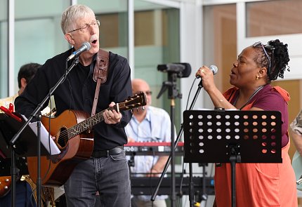 Collins sings with his NIH band outside the Clinical Center.