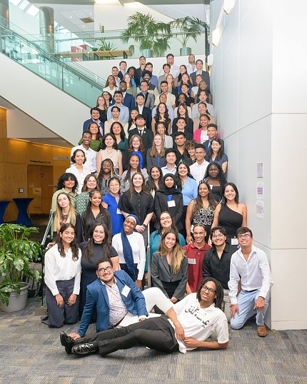 Group shot of students arranged on a flight of stairs.