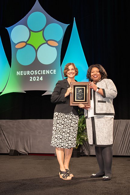 Picciotto presents an award to Jones-London.