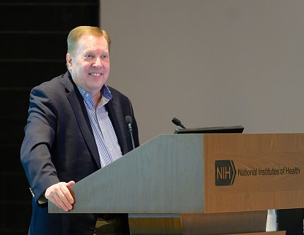 Whitehead smiling at the podium