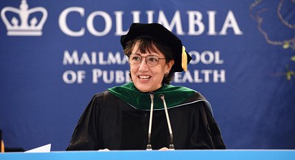 Bertagnolli in graduation regalia at the podium
