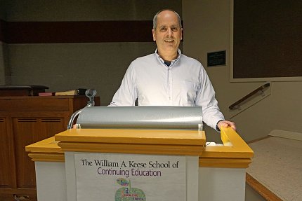 Lorsch stands at a podium
