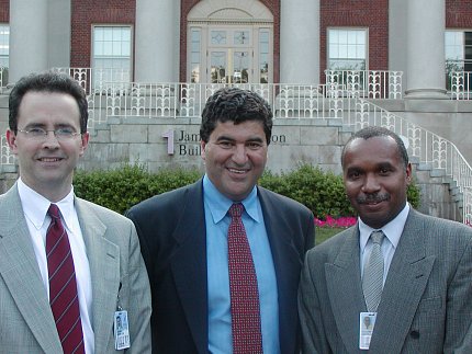 A photo from the early days of Burklow, Zerhouni, Jackson standing in front of Bldg. 1