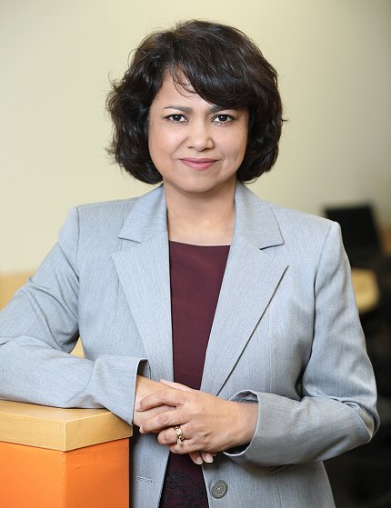 Byrnes standing, leaning on ledge