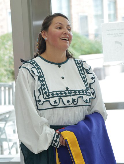 James stands, smiling