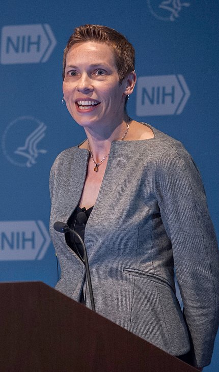 Krebs speaking at the podium.