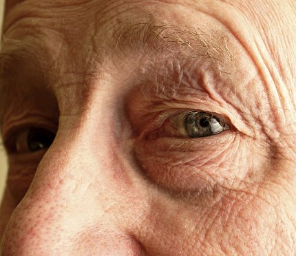 a close up of an older man's eyes
