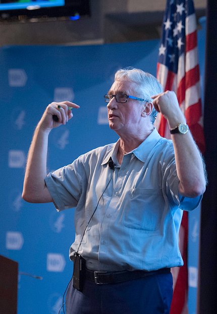 De Waal speaking at lecture.