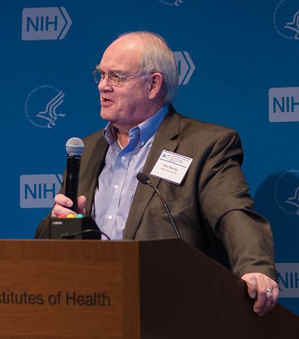 Dr. Paul Sieving speaks at the podium.