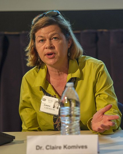 Komives answering a question from the audience.