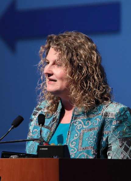 Dr. Carrie Wolinetz speaks at town hall meeting.