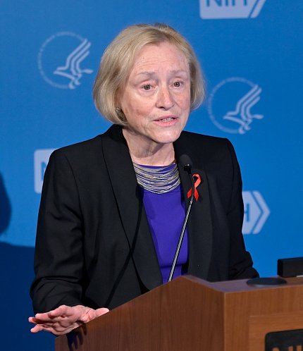 Dr. Goodenow speaks at podium.