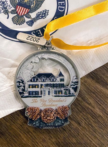 An ornament featuring Alex's design sits on a table.