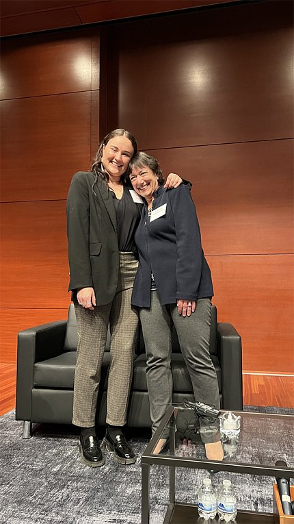 Murray has arm around Bertagnolli as they smile together on stage.