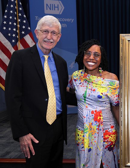 Collins and Dr. Jackson pose together, with big smiles