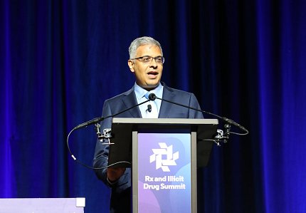 Bhattacharya at the podium