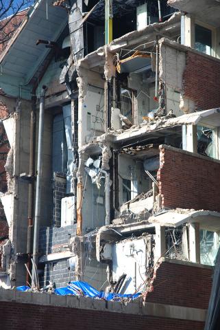 Exposed face of partially flattened building