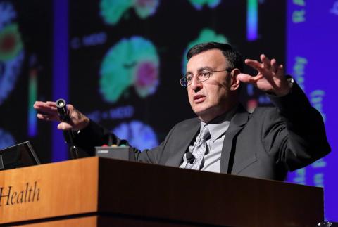 Zarate gestures as he addresses the audience.