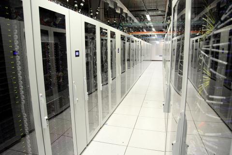 Room of glass-enclosed servers