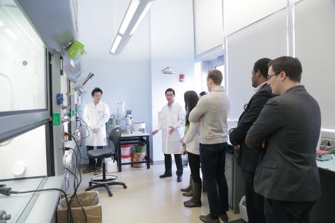 Dr. Chen describes technology for the group.