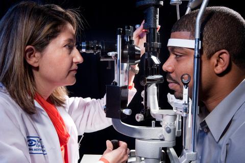 A doctor screens a patient for vision loss