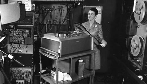 Benschoter inspects a film reel