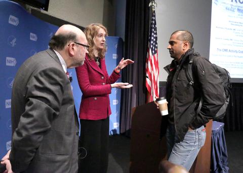 Rudorfer and Lisanby chat with an attendee