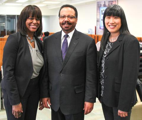 Pugh, Pettigrew and Peng pose together in the NIH Library.