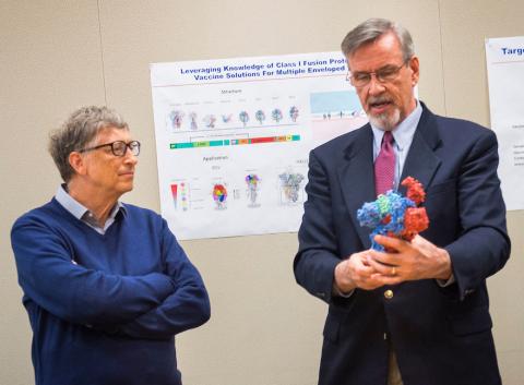 Gates and Graham look at 3-D model of flu virus.