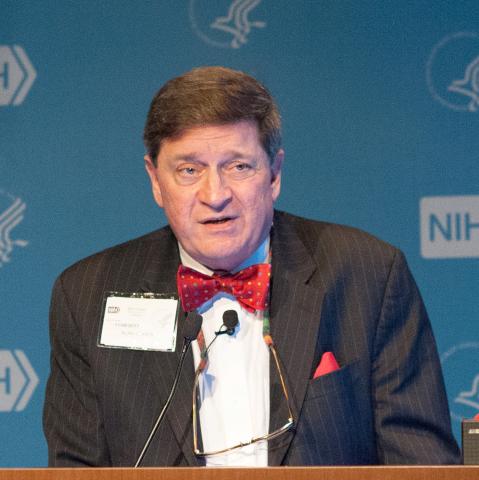 Cohen speaks from podium