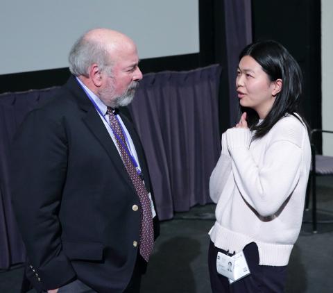 Dr. Groopman speaks to grad student.