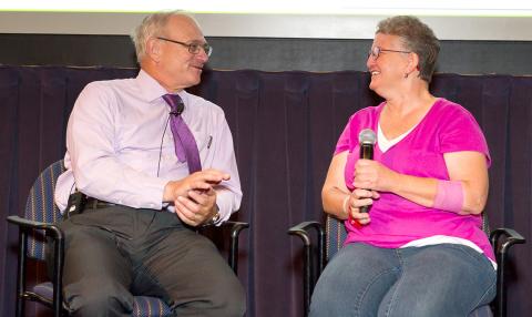 Seated on stage, Gahl and Kelley talk.