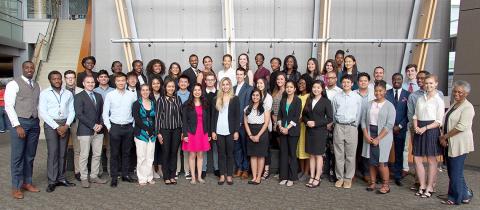 Large group of people smile for camera