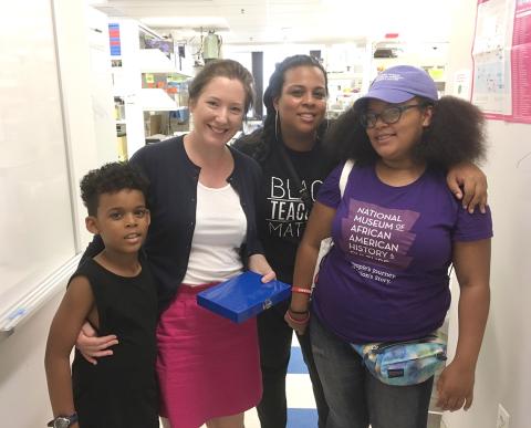 Lucy stands next to Ryan, his mom and his sister