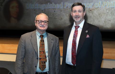 Peter Leeds greets guest lecturer Moreland.