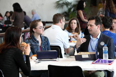 Adam Korengold gets into a spirited discussion with students.