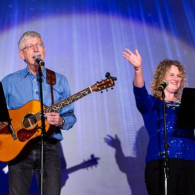 Dr. Collins and Dr. Wolinetz sing