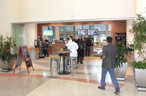 People checking out the new Starbucks Marketplace in the CRC atrium
