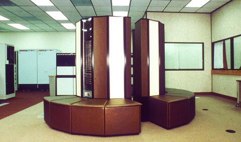 The massive Cray X-MP supercomputer surrounded by benches, used in the late '80s.