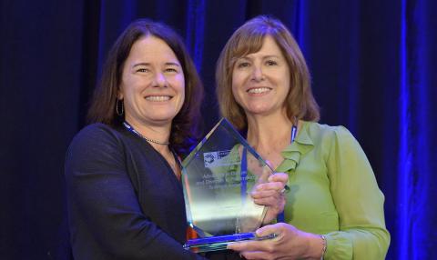 Dr. Kathy Etz is presented with the 2018 Advances in Culture and Diversity in Prevention Science Award.
