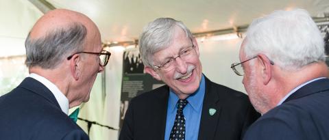 Dr. Roger Glass and Dr. Francis Collins reminisce with Dr. Warren Johnson.